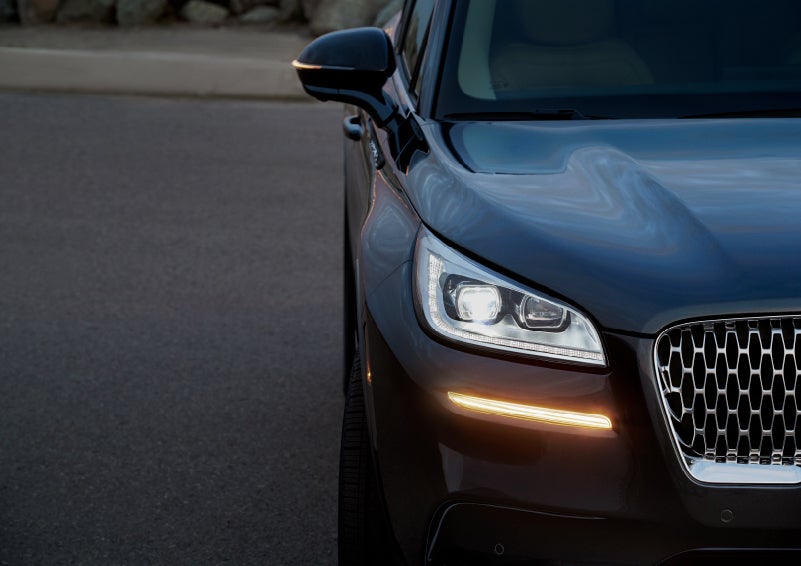 The turn signal on the front fascia is a bold sunset orange stroke of brilliance against a Flight Blue exterior | Bedford Lincoln PA in Bedford PA