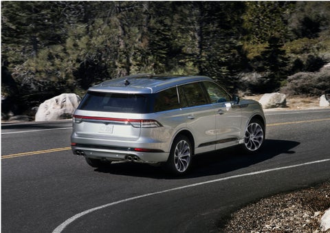 A Lincoln Aviator® is being driven on a winding road | Bedford Lincoln PA in Bedford PA