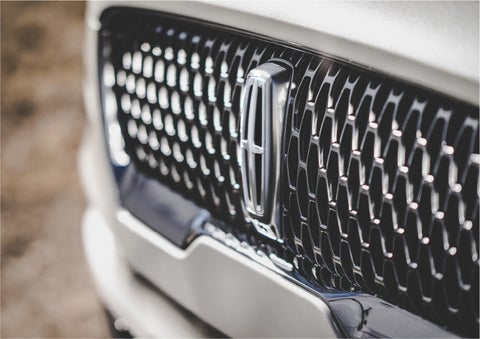 The grille of the 2023 Lincoln Aviator® Reserve model with an eye-catching repeated field of Lincoln Star logo shapes | Bedford Lincoln PA in Bedford PA