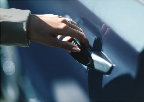 A hand gracefully grips the Light Touch Handle of a 2023 Lincoln Aviator® SUV to demonstrate its ease of use | Bedford Lincoln PA in Bedford PA