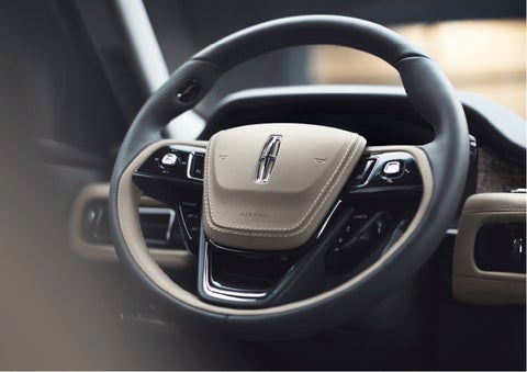 The intuitively placed controls of the steering wheel on a 2023 Lincoln Aviator® SUV | Bedford Lincoln PA in Bedford PA