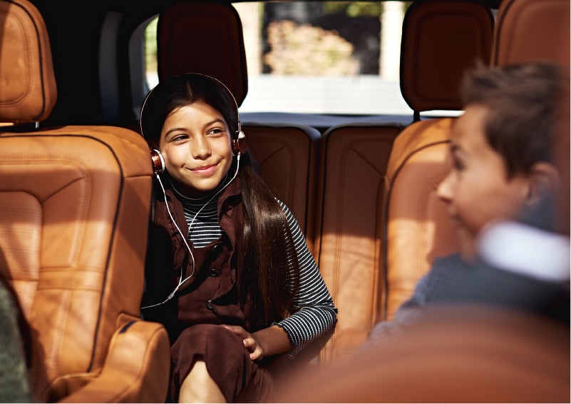 Two young people are comfortably seated in the second and third rows of a Lincoln Aviator® SUV | Bedford Lincoln PA in Bedford PA