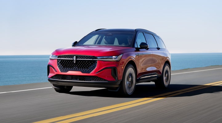 A 2024 Lincoln Nautilus® SUV is being driven on a seaside roadway. | Bedford Lincoln PA in Bedford PA