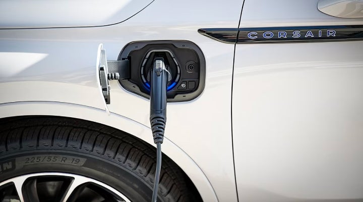 An electric charger is shown plugged into the charging port of a Lincoln Corsair® Grand Touring
model. | Bedford Lincoln PA in Bedford PA