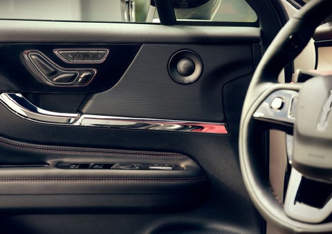 The driver of a 2024 Lincoln Corsair® SUV is shown selecting the drive mode. | Bedford Lincoln PA in Bedford PA