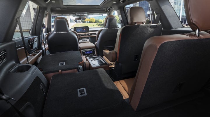One side of the PowerFold® third-row seat and a second-row seat are folded forward in the 2026 Lincoln Aviator® SUV. | Bedford Lincoln PA in Bedford PA