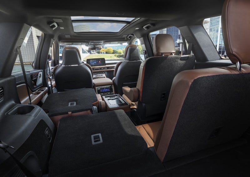 One side of the PowerFold® third-row seat and a second-row seat are folded forward in the 2026 Lincoln Aviator® SUV. | Bedford Lincoln PA in Bedford PA
