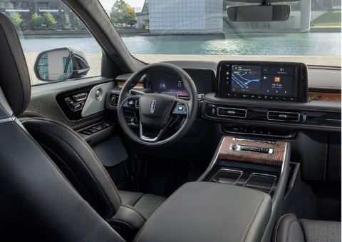 The interior of the 2026 Lincoln Aviator® SUV is shown parked with a view of a harbor through the windshield. | Bedford Lincoln PA in Bedford PA