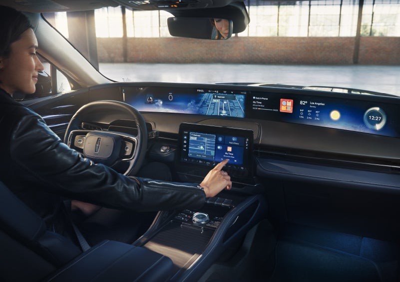 The driver of a 2026 Lincoln Nautilus® SUV interacts with the center touchscreen. | Bedford Lincoln PA in Bedford PA