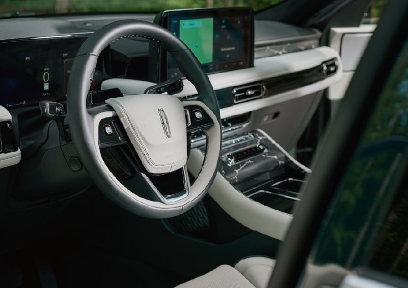 The leather-trimmed steering wheel of a 2027 Lincoln Aviator® Black Label™ SUV. | Bedford Lincoln PA in Bedford PA