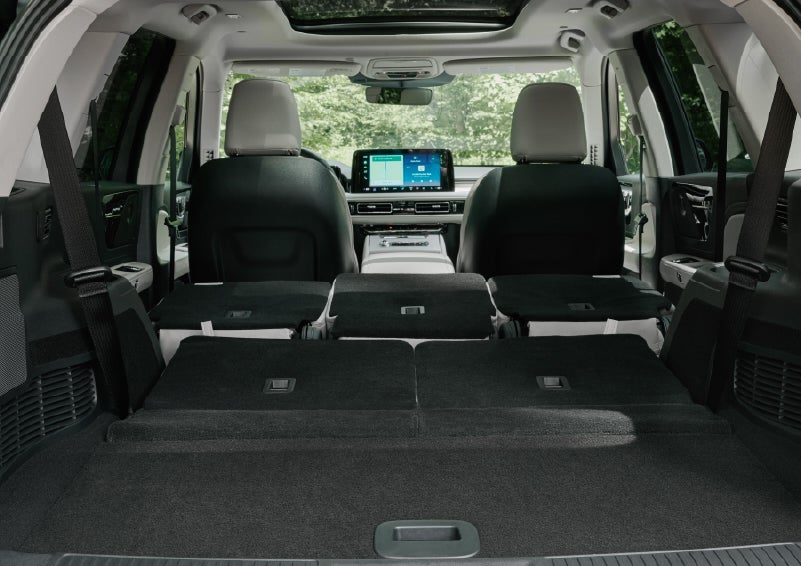 A rear to front view of the interior of a 2027 Lincoln Aviator® Black Label™ SUV shows the third and second rows folded flat | Bedford Lincoln PA in Bedford PA