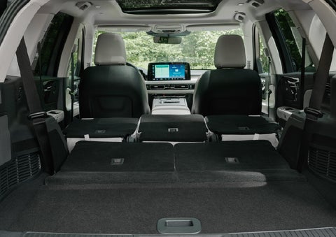 A rear to front view of the interior of a 2027 Lincoln Aviator® Black Label™ SUV shows the third and second rows folded flat | Bedford Lincoln PA in Bedford PA