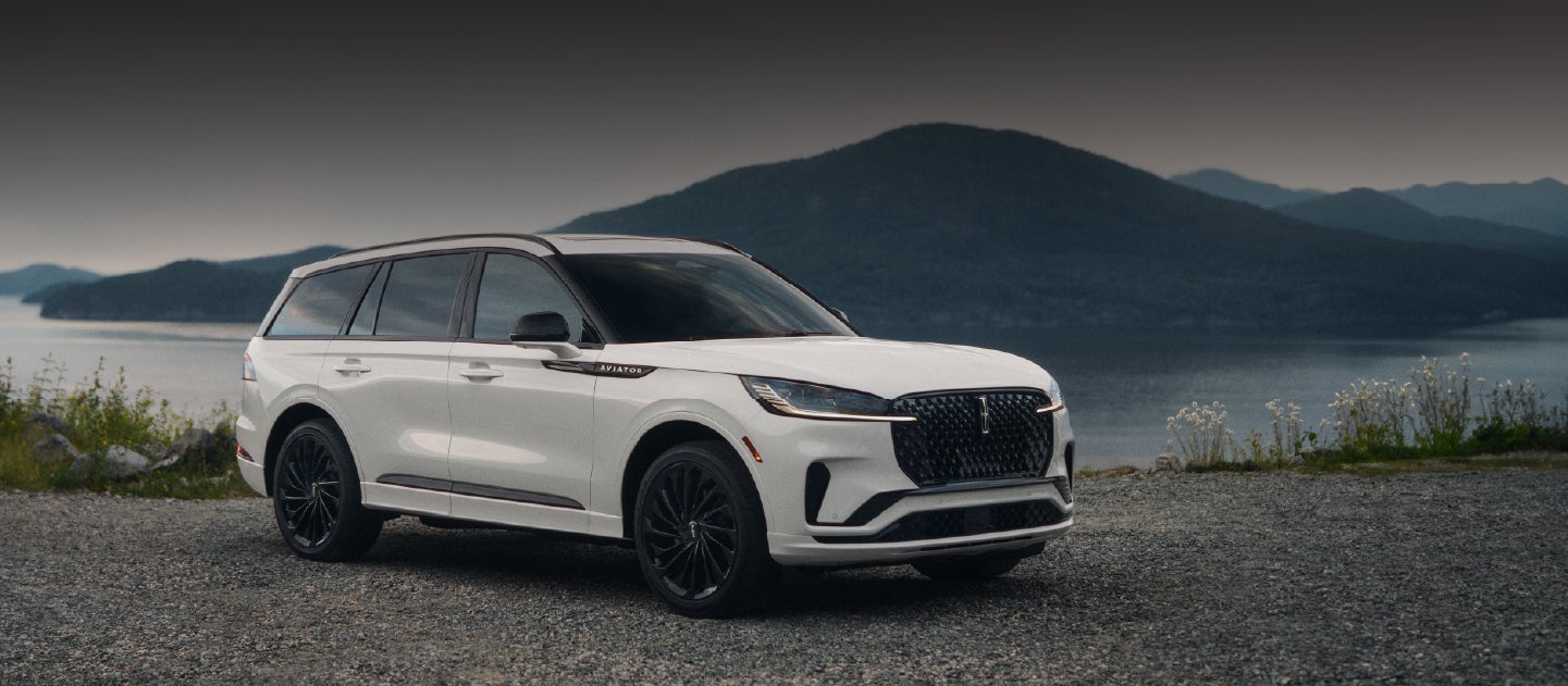 A 2025 Lincoln Aviator® SUV is parked on a mountain overlook.